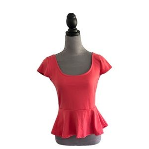 Charlotte Russe short sleeved coral peplum top. Size S